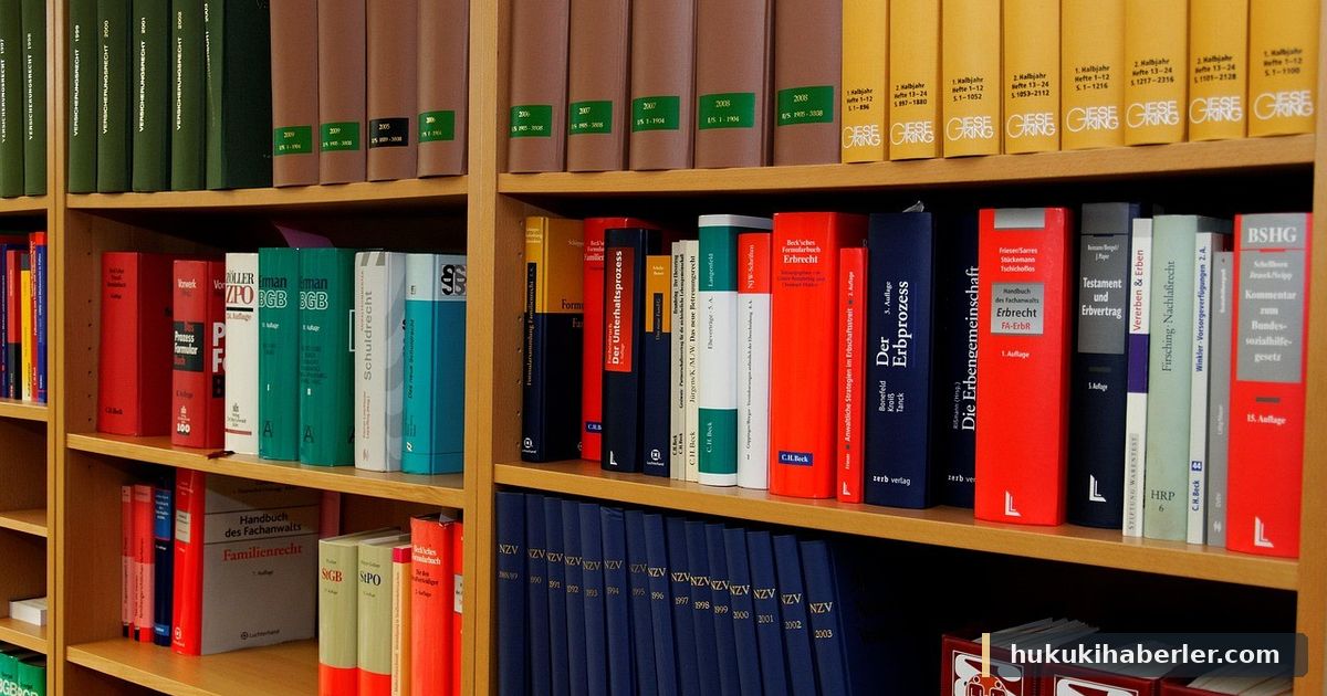 Mavi ve kırmızı ciltli hukuk kitapları dolu ahşap kitaplık rafları
